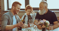 Men having dinner with son