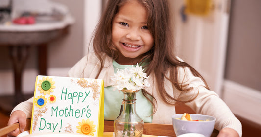Girl bringing flowers for mother.